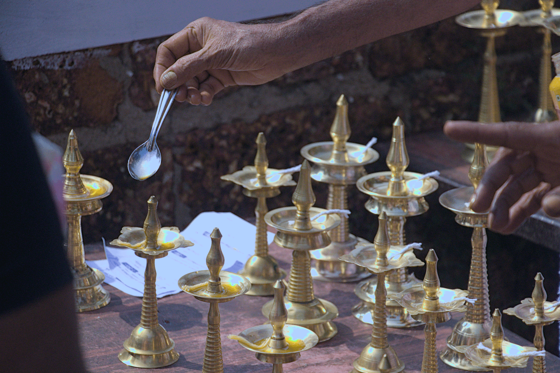 Pouring oil into Oil lamps